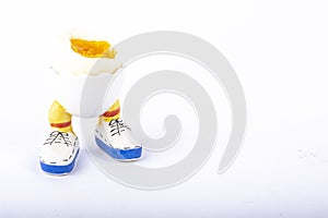 Boiled egg open half with legs isolate