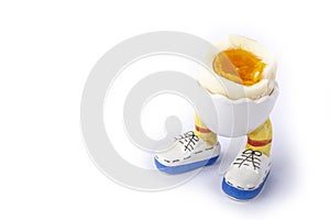 Boiled egg open half with legs isolate