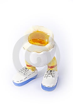 Boiled egg open half with legs isolate
