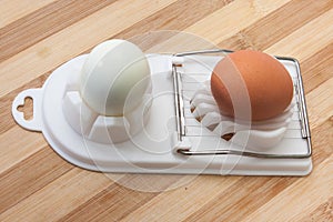 Boiled egg and sliced egg on the chopper