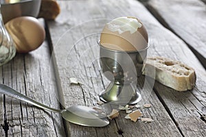 Boiled egg on vintage wooden boards