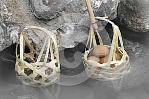Boiled eggs in basket in nature hot springs