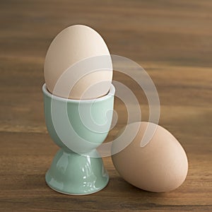 Boiled eggs, eggcup, breakfast.