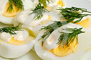 Boiled eggs with mayonnaise and dill.