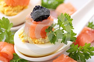 Boiled eggs with red black caviar