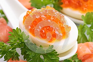 Boiled eggs with red caviar