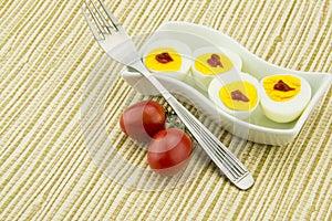 Boiled eggs, red cherry tomatoes