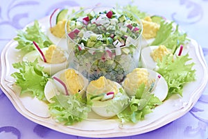 Boiled eggs with salad, cucumber and radish