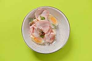 Boiled eggs with smoked ham and vegetables. Healthy vegetarian diet. Veggies salad