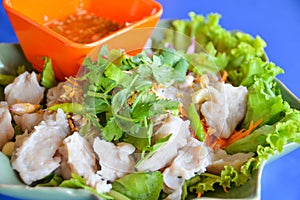 Boiled fish meatball with Thai style hot and spicy seafood sauce dip.