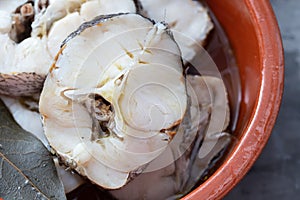 boiled fresh fish in brown ceramic pot