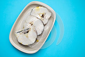 boiled fresh fish with oil in dish