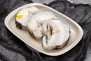 boiled fresh fish with oil in dish