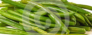 Boiled green beans close-up. French string beans, Haricots Verts, on white plate photo