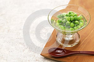 Boiled green peas and then soaked in Japanese dashi soup