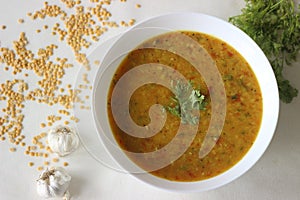 Boiled lentils tempered with garlic and spices. A favourite side dish from India popularly known as Yellow Daal Tadka