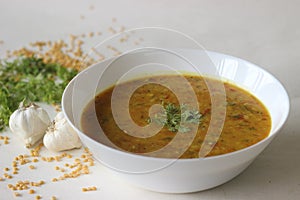 Boiled lentils tempered with garlic and spices. A favourite side dish from India popularly known as Yellow Daal Tadka