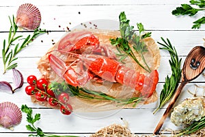 Boiled lobster with spices on a white background. Top view.