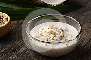 Boiled millet with coconut soup in glass bowl