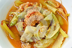 Boiled mixed vegetable and fish egg in Thai spicy soup on bowl