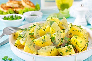 Boiled new potato with butter, dill and green onion