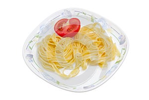 Boiled noodles and half fresh tomato on dish