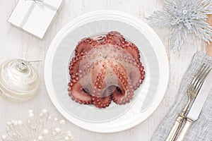 Boiled octopus on white plate