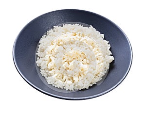 Boiled parboiled rice in gray bowl isolated