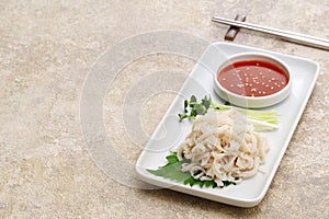 Boiled, peeled and whitened beef omasum sashimi. photo