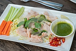 Boiled pork with lime garlic and chili sauce, Thai food