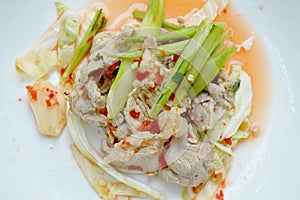 Boiled pork slice dressing with lime garlic and chili sauce salad on plate