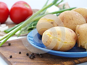 Boiled potatoes in blue dish