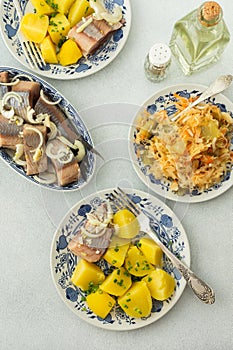 Boiled potatoes with pickled herring and sauerkraut