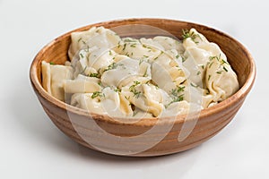 Boiled prepared homemade russian dumplings or pelmeni with beef meat