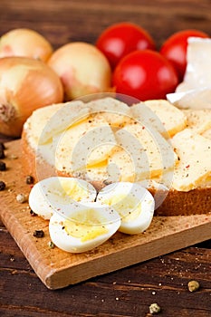 Boiled quail eggs and bread with Romadur cheese