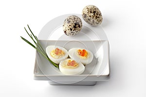 Boiled quail eggs with trout eggs and chive