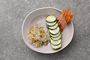 Boiled Quinoa and vegetables in a bowl on the table, healthy eating,