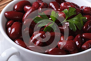 Boiled red kidney beans in white bowl close-up horizontal