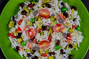 Boiled rice, avocado, fresh vegetable salad, cherry tomatoes Delicious and healthy breakfast of healthy nutrition food