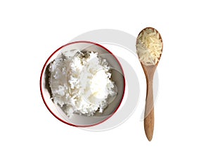 Boiled rice in bowl with raw jasmine rice in wooden spoon top view isolated on white background.