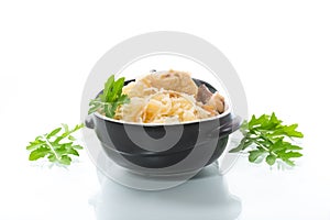 boiled rice with vegetables and meat in a ceramic bowl