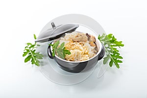 boiled rice with vegetables and meat in a ceramic bowl