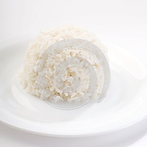 Boiled rice on a white plate photo