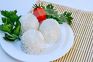Boiled rice with cheese on white plate on white background photo