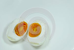Boiled salty egg half cut on plate