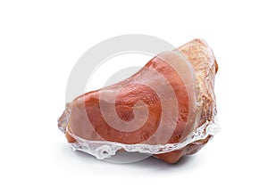 Boiled and smoked pork knuckle in vacuum pack isolated on white