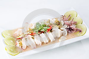 Boiled squid served in white dish