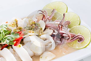 Boiled squid served in white dish