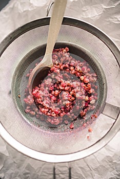 Boiled White and red currant berries, extracting juice