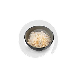 Boiled rice in a small dish on a white background isolated
